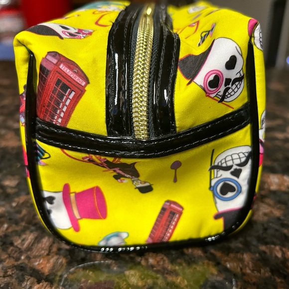 NWOT Betsey Johnson makeup travel bag in vibrant yellow with skull design. - Picture 5 of 10
